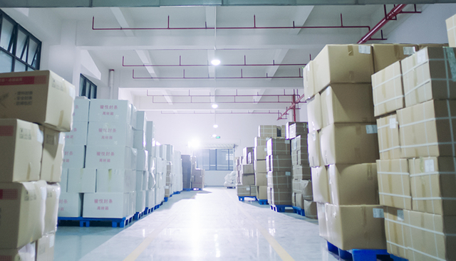 Warehouse with stacked containers