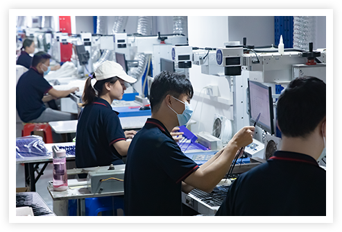Factory workers operating machines